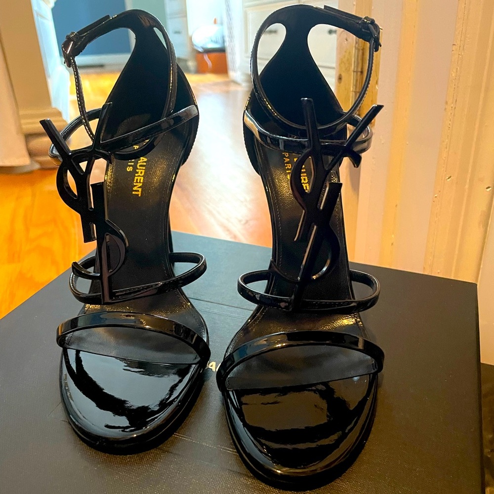 Brand new never worn black on black YSL logo sandal heels. Duster bags included.